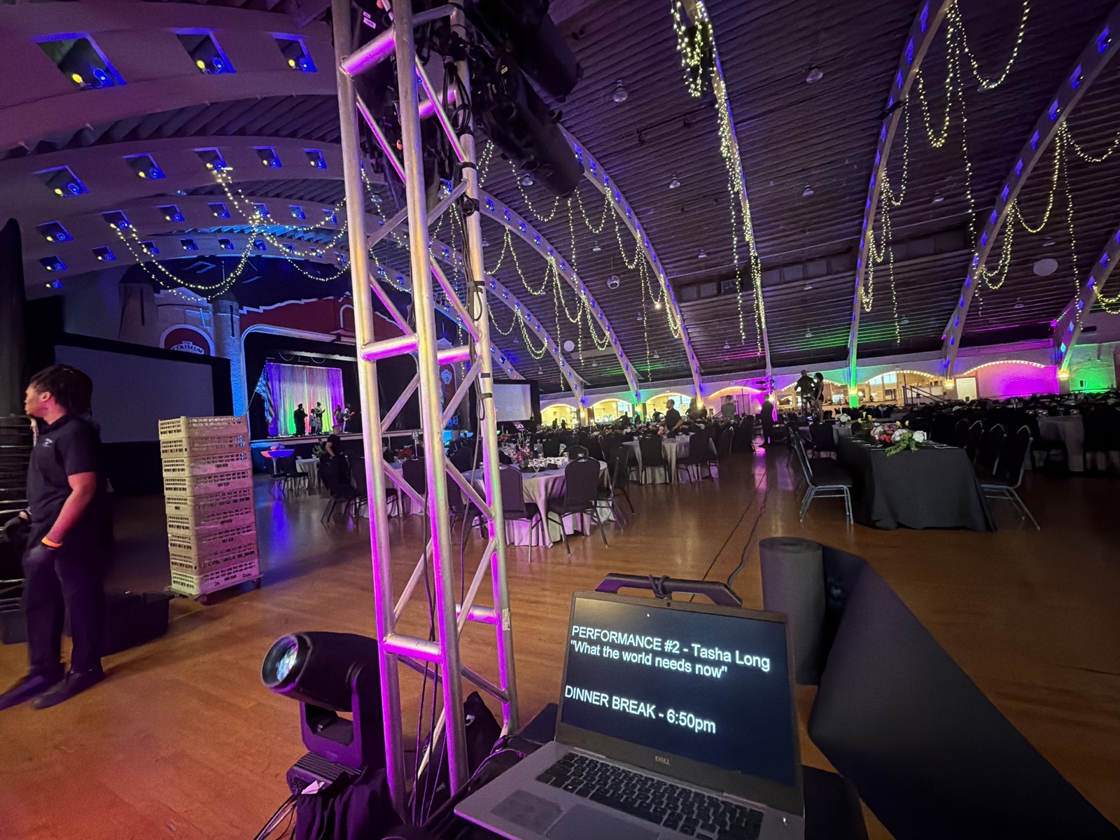 Operator laptop with run-of-show cues at a gala production
