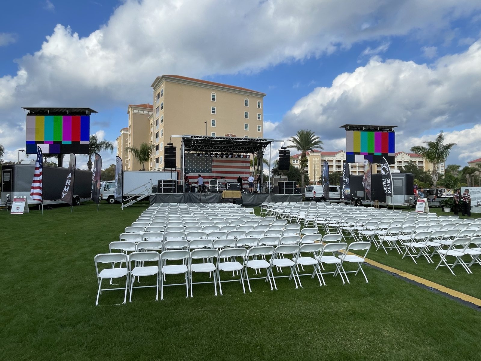 Outdoor stage with flag backdrop set for a speaker